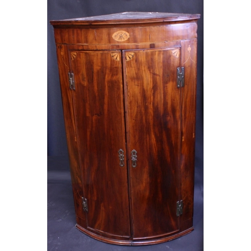 1481 - A George III mahogany bow fronted wall-hanging corner cupboard, moulded cornice, deep frieze inlaid ... 