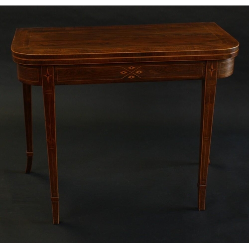 1486 - A George IV rosewood D-shaped card table, folding crossbanded top enclosing an inset baize lined pla... 