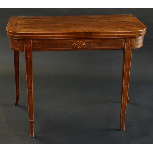 1486 - A George IV rosewood D-shaped card table, folding crossbanded top enclosing an inset baize lined pla... 