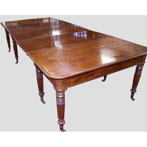 1487 - A George/William IV mahogany rounded rectangular dining table, moulded top above a deep frieze, turn... 