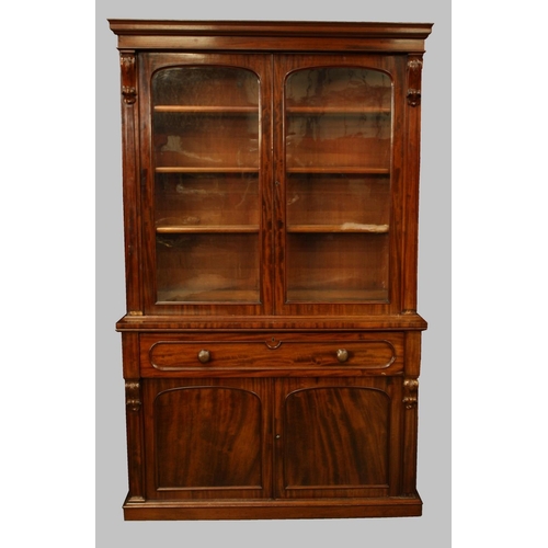 1493 - A Victorian mahogany library bookcase, stepped cornice above open adjustable shelves, the projecting... 