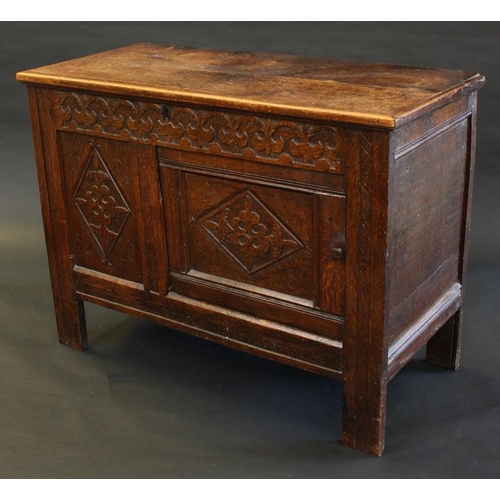 1495 - An '18th century' oak blanket chest, hinged top now enclosing a shallow compartment above a door, ca... 