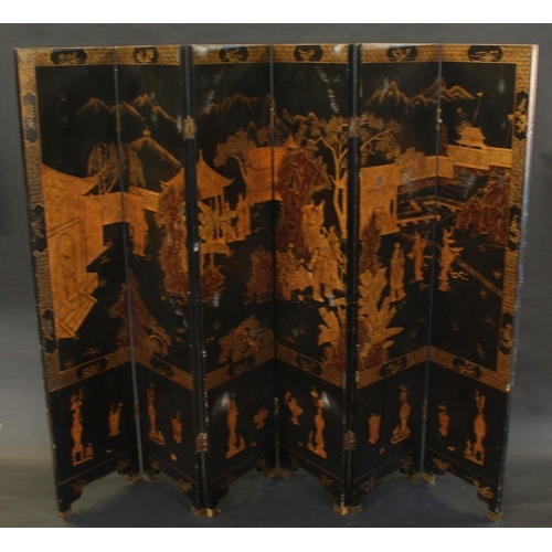 1497 - An 18th century style Chinese six-fold dressing screen, decorated in gilt faux-lacquer with monument... 