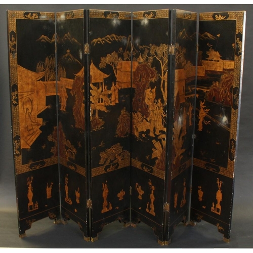 1498 - An 18th century style Chinese six-fold dressing screen, decorated in gilt faux-lacquer with monument... 