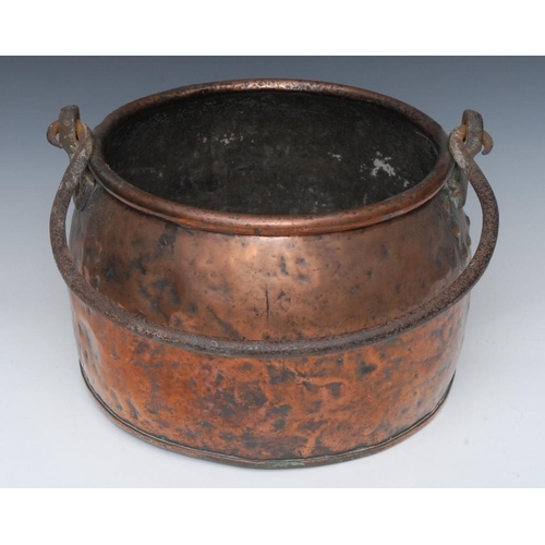 1501 - An early 19th century copper cauldron, wrought iron swing handle