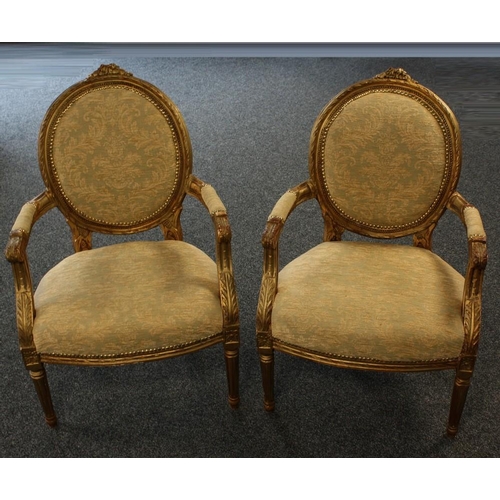 1503 - A pair of Louis XVI Revival giltwood and gesso armchairs, in the Adam taste, oval backs, scroll arms... 