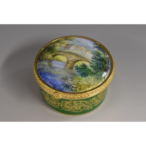 151 - A Lynton porcelain circular table box, painted by Stefan Nowacki, signed, with a view of Kedleston H... 