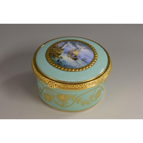 154 - A Lynton porcelain circular table box, painted by Stefan Nowacki, signed, with English schooners off... 