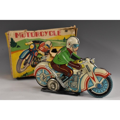 3171 - A tinplate clockwork MS 702 motorcycle, lithoprinted details, green rider, blue and white bike, No 2... 