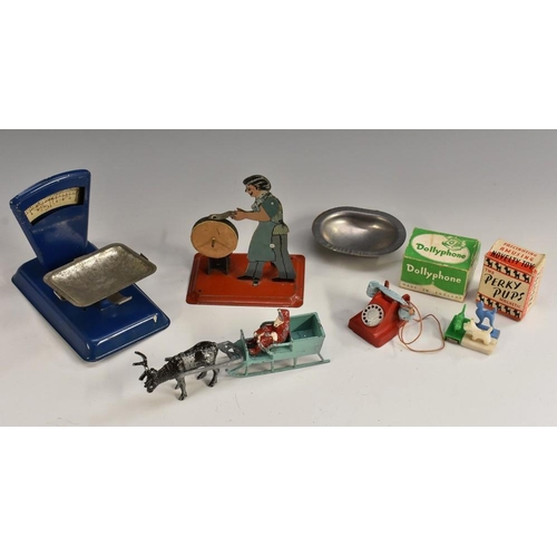 3173 - Toys - a tin plate model figure knife sharpener, others scales;  cast metal Dollyphone, red, silver ... 