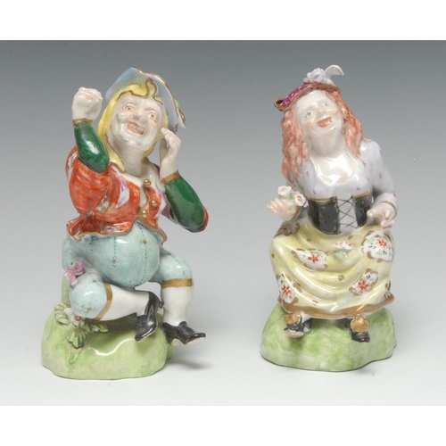 165 - A rare pair of Bloor Derby figures, of Grimacing Dwarfs, each grotesque modelled sitting on a grassy... 