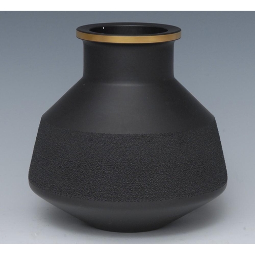 342 - A Wedgwood black basalt vase, designed by Robert Minkin, with textured band, gilt line rim, 14cm hig... 