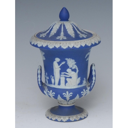 343 - A Wedgwood Blue Jasper campana shaped vase and cover, sprigged in white with classical figures, the ... 