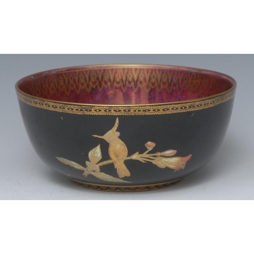 348 - A Wedgwood Fairyland lustre bowl, designed by Daisy Makeig-Jones, printed and painted in coloured en... 