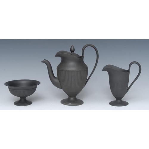 355 - A Wedgwood three piece black basalt pedestal urnular coffee pot and cover, milk jug and sugar bowl, ... 