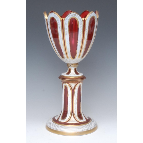 370 - A 19th century Bohemian ruby glass goblet on pedestal, fluted bowl, banded in white outlined in gilt... 