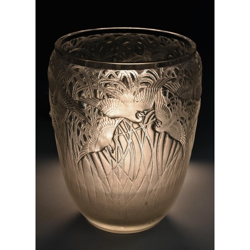 389 - A Rene Lalique ''Aigrettes'' pattern vase, of flared cylindrical form, the upper section moulded in ... 