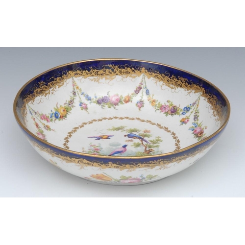 390 - An 18th century Sèvres bowl, the interior decorated with fanciful birds within a gilt husk cartouche... 