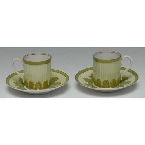 408 - A pair of Russian Gardner porcelain leaf-moulded and reeded coffee cans and saucers, glazed in two t... 