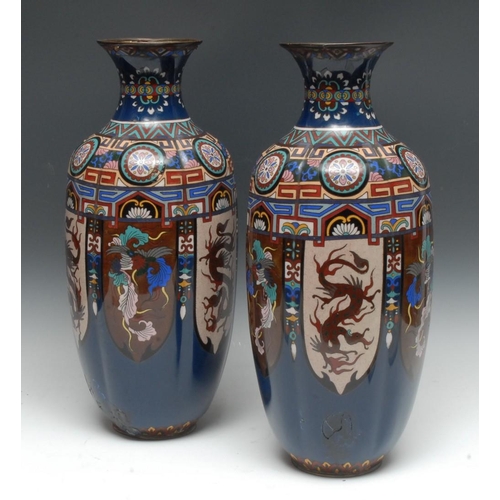 419 - A pair of Chinese cloisonné vases, the shoulders with colourful geometric patterns, the sides with a... 