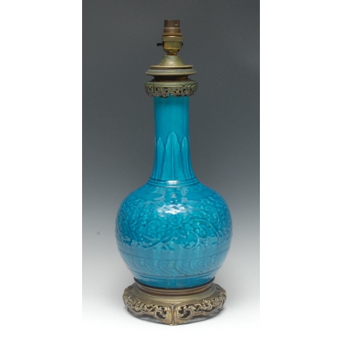 420 - A 19th century bronze-mounted monochrome bottle vase, moulded in relief with a profusion of leafy fl... 