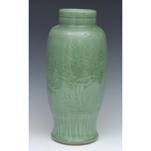 425 - A Chinese celadon ovoid vase, incised in relief with stylised flowers and foliage, 36cm high, 19th c... 