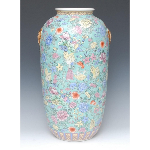 438 - A Chinese Republic Period ovoid vase, incised overall with peonies and other flowers on a turquoise ... 