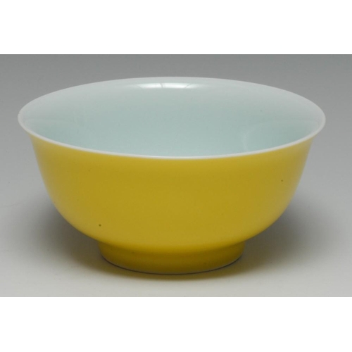 447 - A Chinese yellow monochrome bowl, quite plain, flared rim, 11.5cm diam, Kangxi double-circle and six... 