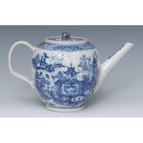 470 - An 18th century Chinese lobed ovoid teapot and cover, decorated in underglaze blue, with pagoda, tre... 