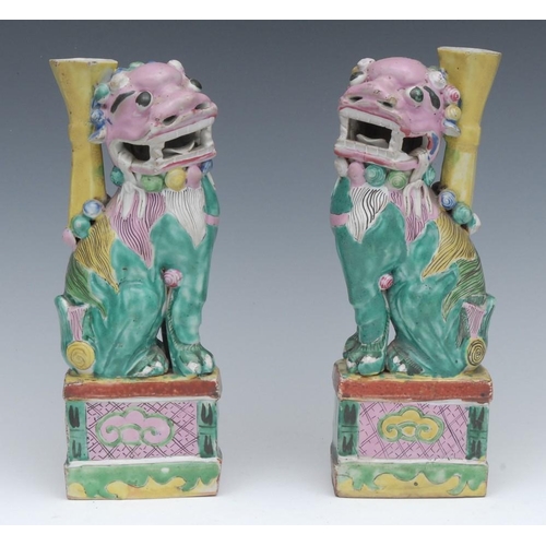 474 - A pair of Chinese stoneware polychrome Dogs of Fo, in pink, green and yellow, 23.5cm high, 19th cent... 