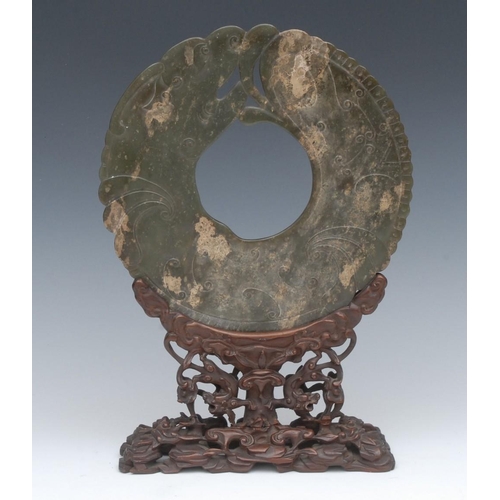 475 - ***Please note amended size, this is 22cm diameter*** A 19th century Chinese Jade bi-disc, carved an... 