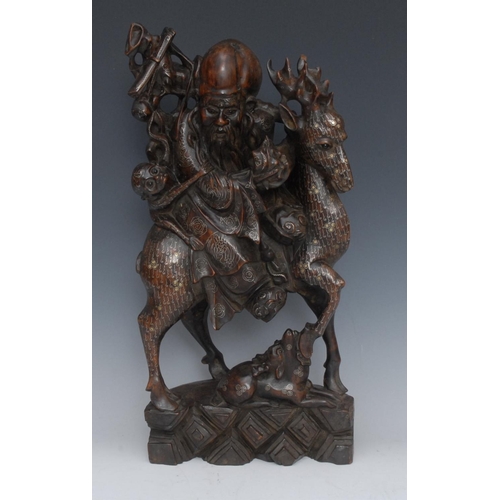 479 - A Chinese hardwood carving, of a scholar riding on a stag, a monkey clinging to the back, a deer by ... 