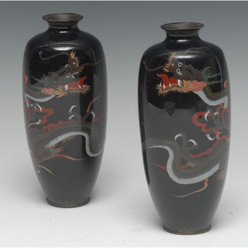 490 - A pair of Japanese cloisonné enamel vases, finely decorated in polychrome with ferocious dragons in ... 