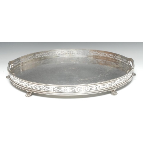 506 - A Victorian E.P.N.S oval gallery tray, in the Neo-Classical Revival taste, bright-cut engraved field... 