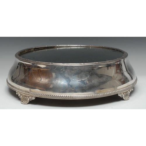 514 - An early 20th century EPNS circular cake plateau, mirrored field, the side engraved with bell husk s... 