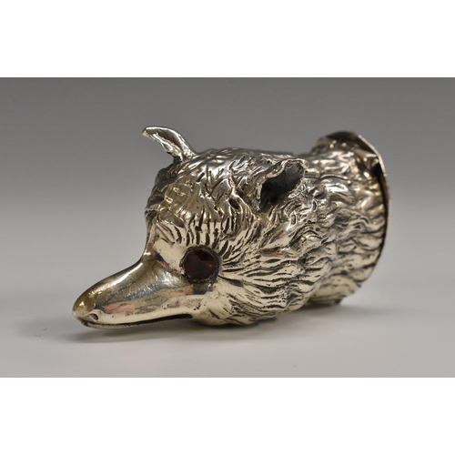 599 - A silver novelty bonbonniere, cast as the head of a fox, hinged cover, faceted glass eyes, 5cm long,... 