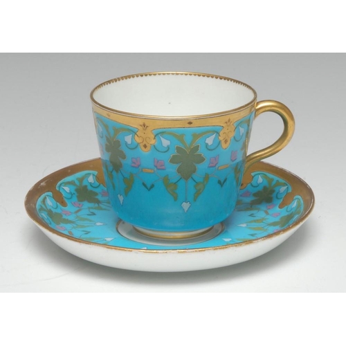 63 - A Minton cup and saucer, influenced by Dr Christopher Dresser, with leafy fronds, foliage and scroll... 