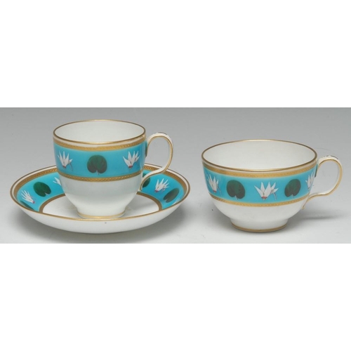 66 - A Minton teacup, coffee cup and saucer, influenced by Dr Christopher Dresser, painted with lily flow... 