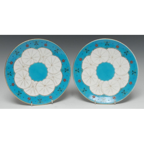 71 - A pair of Mintons circular dessert plates, influenced by Dr Christopher Dresser, moulded in relief w... 