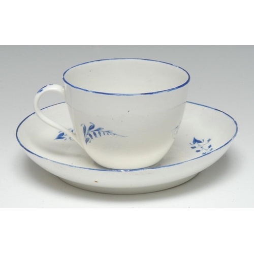 98 - A Pinxton Bute-shaped teacup and saucer, pattern 2, blue line border, the saucer 15cm diam, c.1800