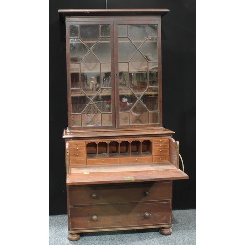 95 - A 19th century mahogany secretaire bookcase, astragal glazed upper section, fitted drawer, bun feet ... 