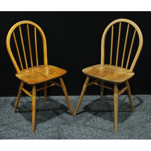 97 - A set of four elm dining/side chairs, hooped backs, saddle seats(4)