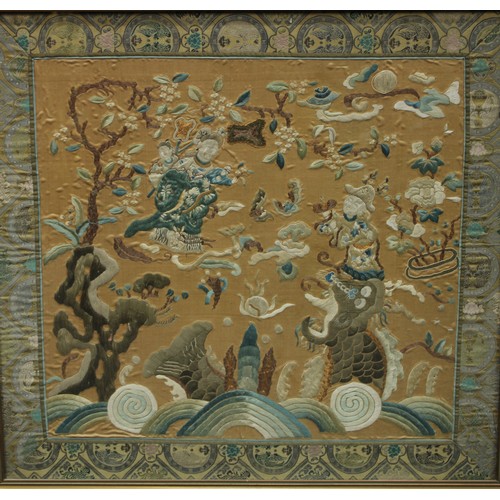 187 - An Oriental textile wall panel, woven throughout with figures in traditional dress, blossoming prunu... 