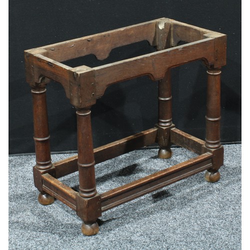 152 - A 18th century oak table base, canon-barrel legs, bun feet, 63cm high, 70cm wide, 37cm deep, c.1720