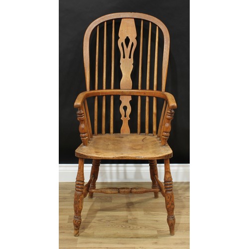 153 - A Windsor armchair, pierced slat, h-stretcher