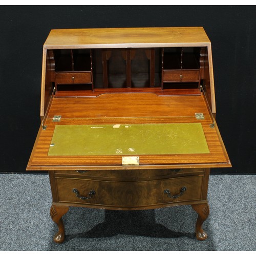 159 - An Art Deco walnut veneered bureau,  fall front enclosing a fitted interior above three long graduat... 