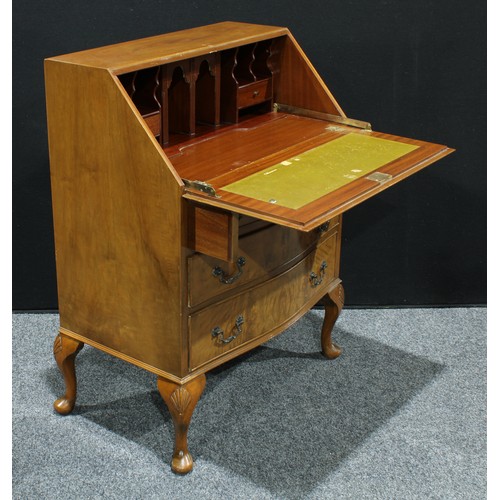 159 - An Art Deco walnut veneered bureau,  fall front enclosing a fitted interior above three long graduat... 