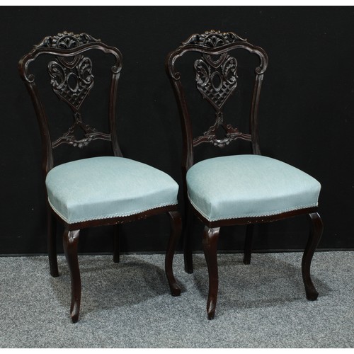 163 - A pair of late Victorian/Edwardian mahogany dining side chairs, Chinese Chippendale inspired; anothe... 