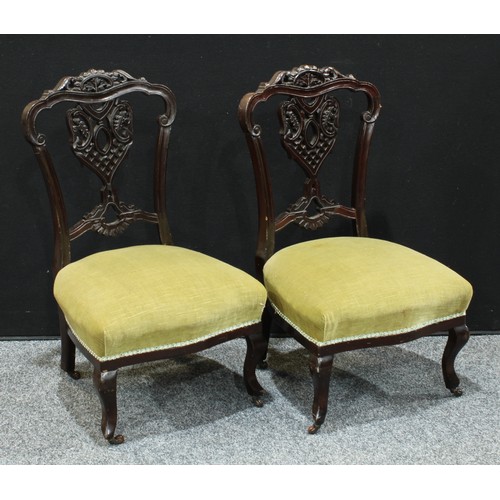 163 - A pair of late Victorian/Edwardian mahogany dining side chairs, Chinese Chippendale inspired; anothe... 