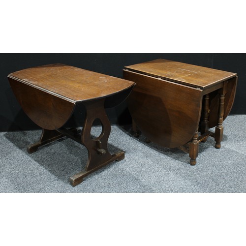 168 - An oak oval gateleg dining table and four oak ladder back dining chairs; an oak oval drop leaf dinin... 